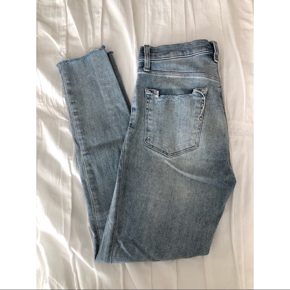 Distressed light wash skinny jeans